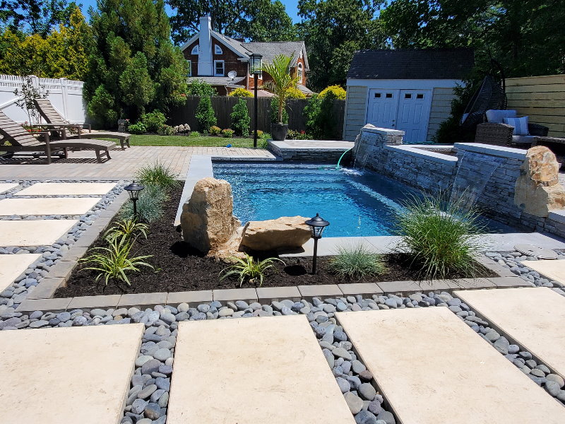 zen landscape design backyard with spa and waterfall